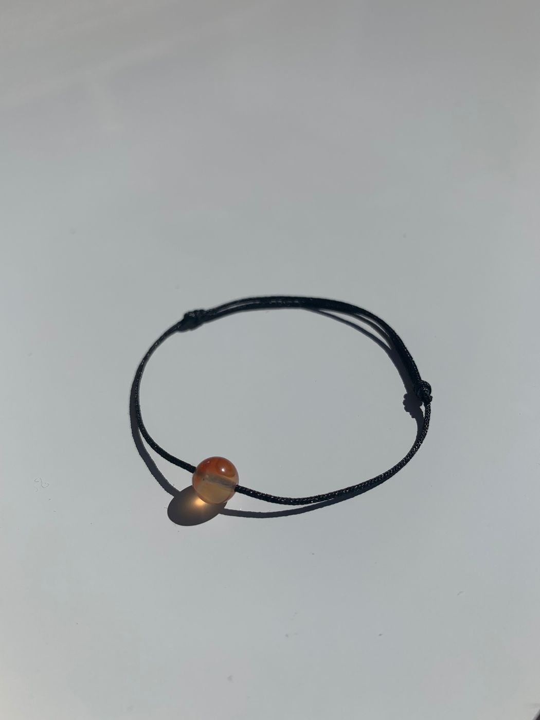 Bracelet Bélier, cordon noir satiné, version épurée